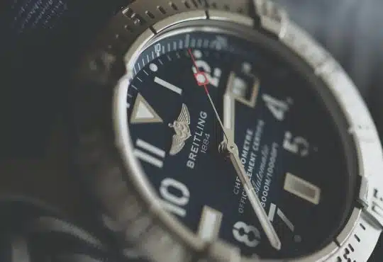 analog watch reading at 2:38